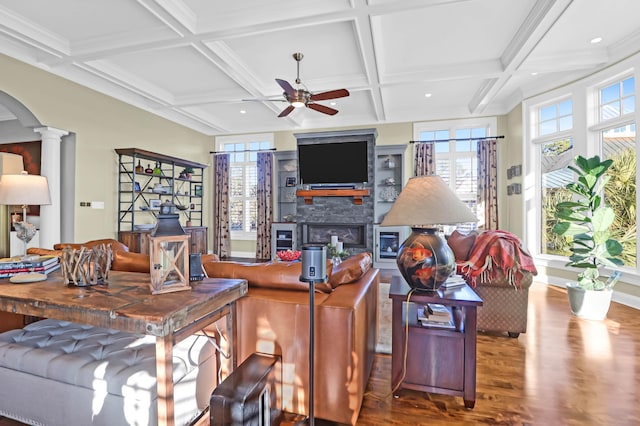 living room with coffered ceiling, hardwood / wood-style floors, ceiling fan, beam ceiling, and decorative columns