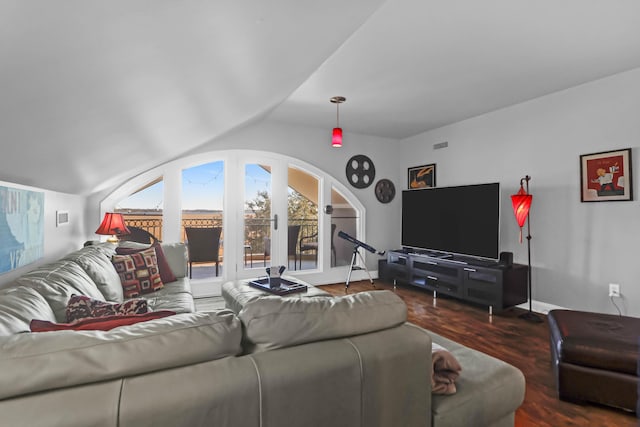 living room featuring lofted ceiling and dark hardwood / wood-style flooring