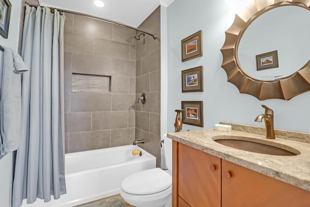 full bathroom with vanity, shower / tub combo with curtain, and toilet