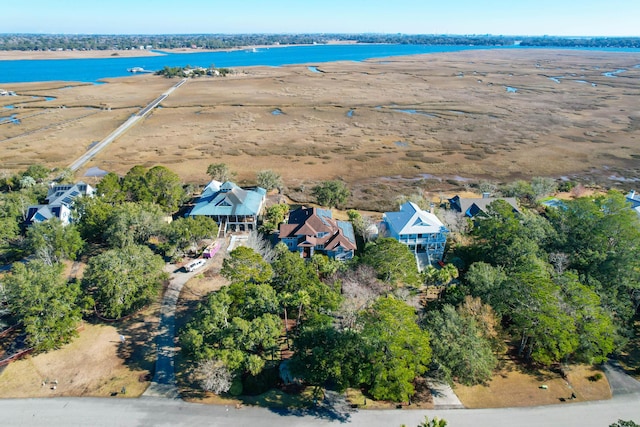 birds eye view of property featuring a view of the beach and a water view