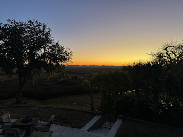 view of patio terrace at dusk