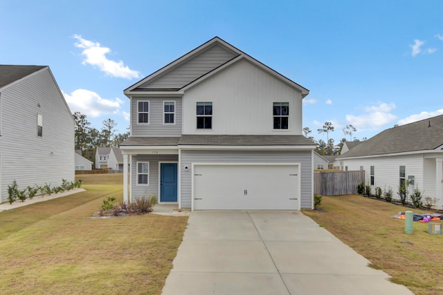 view of property with a front yard and a garage