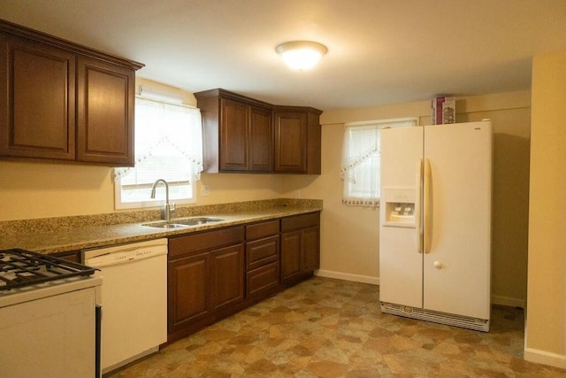 424 Salley Ackerman Dr, Cottageville, SC 29435 - kitchen featuring a sink, baseboards, white appliances, and light countertops