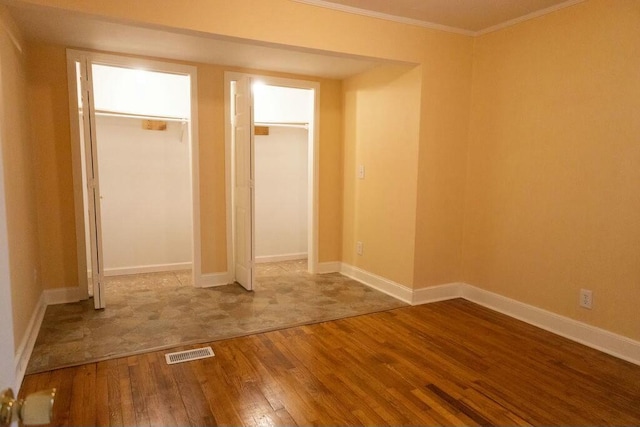 424 Salley Ackerman Dr, Cottageville, SC 29435 - unfurnished bedroom featuring baseboards, visible vents, wood-type flooring, and ornamental molding