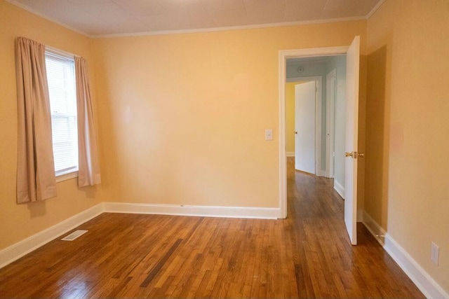 424 Salley Ackerman Dr, Cottageville, SC 29435 - unfurnished room with visible vents, baseboards, wood finished floors, and ornamental molding