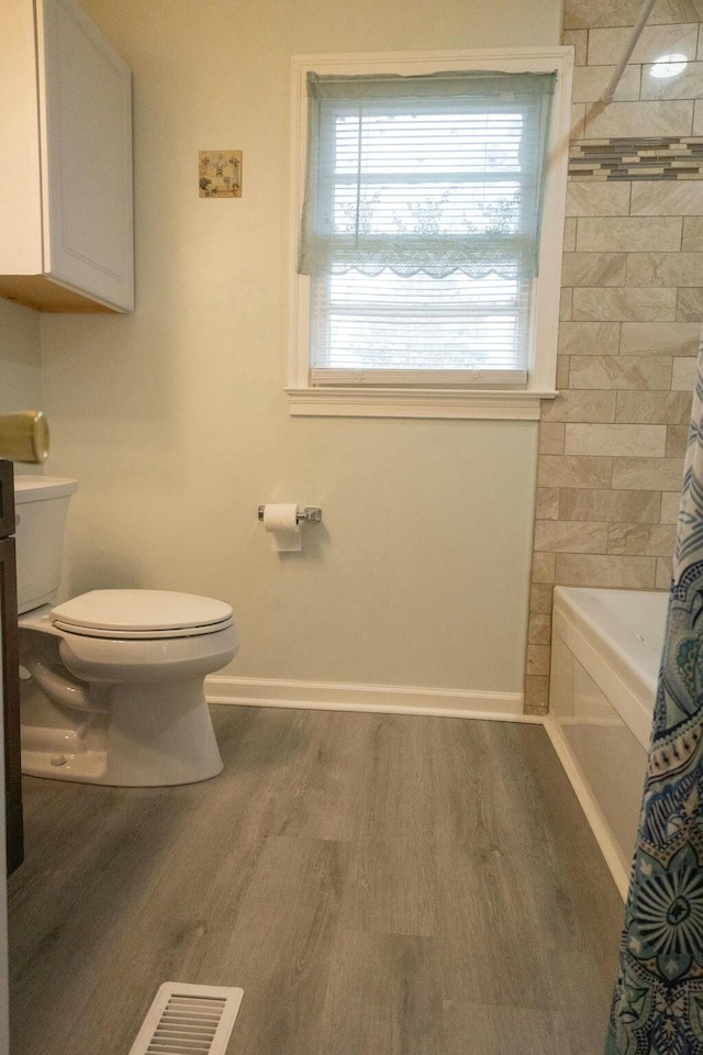 424 Salley Ackerman Dr, Cottageville, SC 29435 - bathroom featuring visible vents, baseboards, toilet, and wood finished floors
