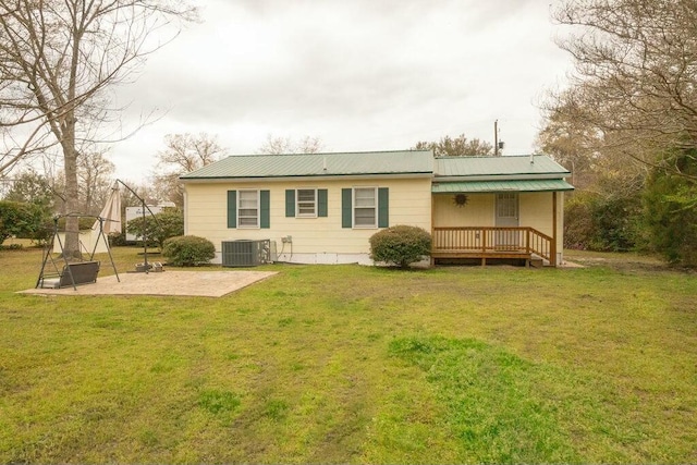 424 Salley Ackerman Dr, Cottageville, SC 29435 - rear view of property with metal roof, a yard, central AC unit, and a patio area