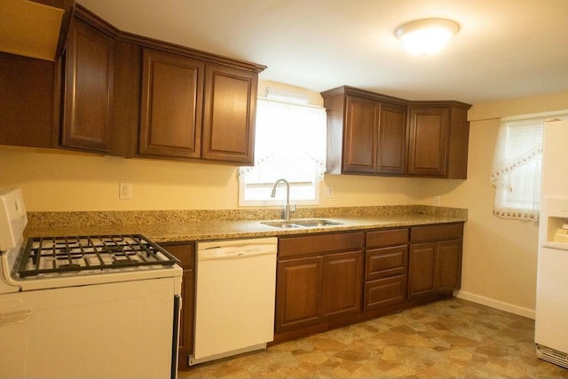 424 Salley Ackerman Dr, Cottageville, SC 29435 - kitchen featuring white appliances, light countertops, baseboards, and a sink