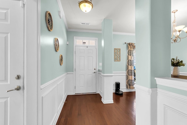 108 Glenspring Dr, Summerville, SC 29486 - foyer with dark wood finished floors, a chandelier, crown molding, and a wainscoted wall