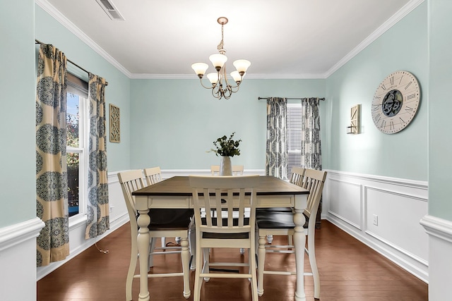 108 Glenspring Dr, Summerville, SC 29486 - dining room featuring a chandelier, ornamental molding, wood finished floors, and a wainscoted wall
