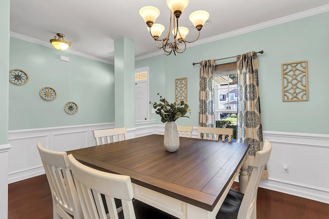 108 Glenspring Dr, Summerville, SC 29486 - dining room featuring a chandelier, ornamental molding, a wainscoted wall, dark wood-style floors, and a decorative wall