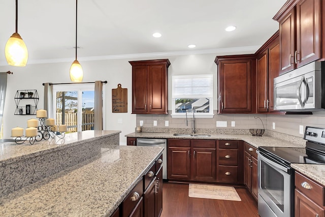 108 Glenspring Dr, Summerville, SC 29486 - kitchen with appliances with stainless steel finishes, a sink, dark wood-style flooring, tasteful backsplash, and pendant lighting