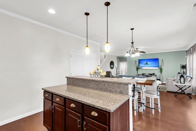 108 Glenspring Dr, Summerville, SC 29486 - kitchen featuring a center island, ornamental molding, open floor plan, dark wood-style floors, and baseboards