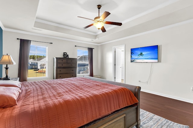 108 Glenspring Dr, Summerville, SC 29486 - bedroom with a tray ceiling, wood finished floors, baseboards, crown molding, and a ceiling fan