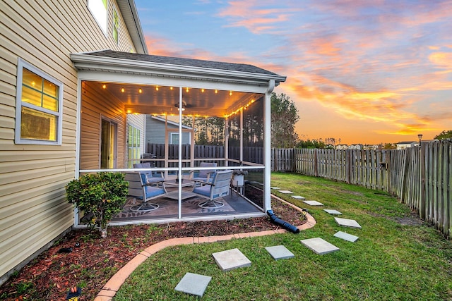 108 Glenspring Dr, Summerville, SC 29486 - yard at dusk featuring a patio area and a sunroom