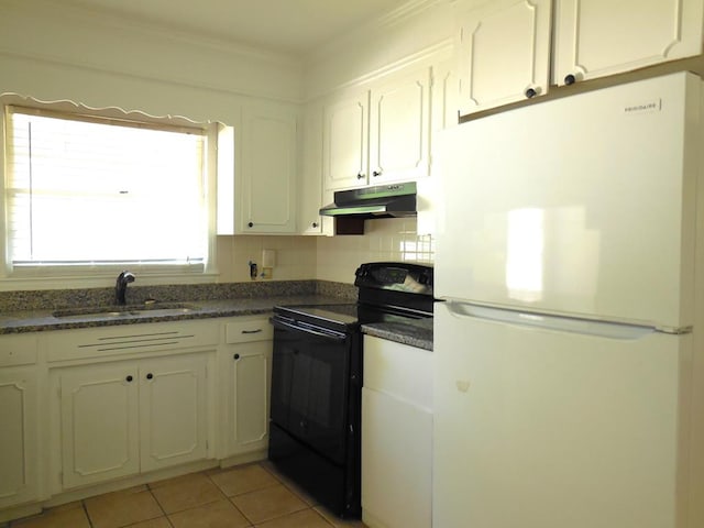 kitchen with sink, black electric range oven, white fridge, and white cabinetry