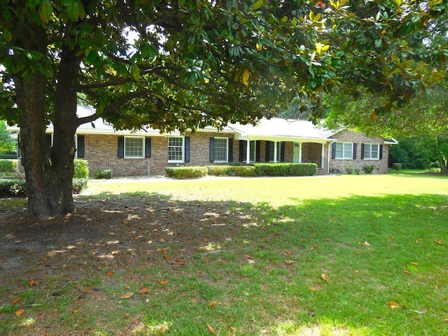 ranch-style home with a front lawn