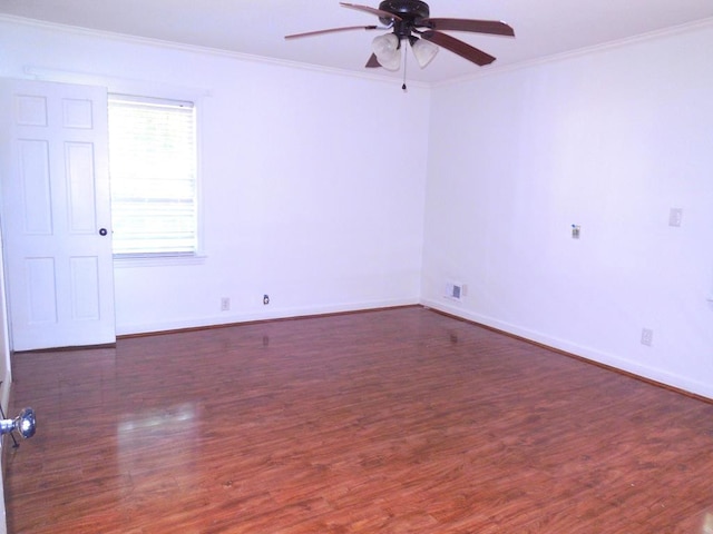 empty room with ornamental molding, dark hardwood / wood-style flooring, and ceiling fan