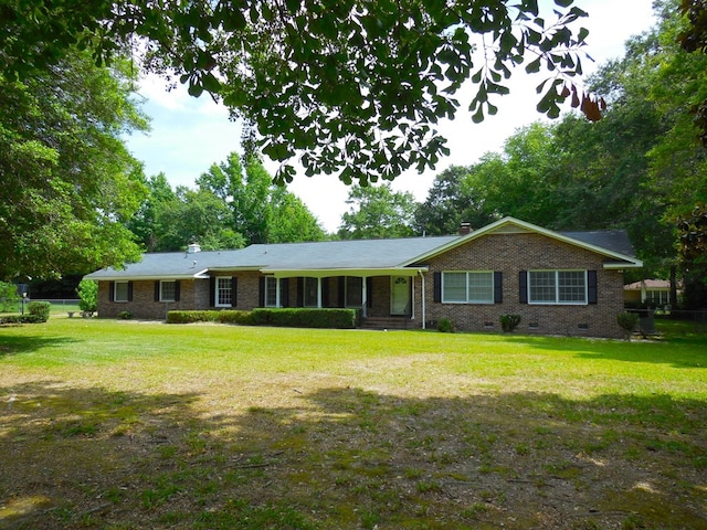 ranch-style house with a front lawn