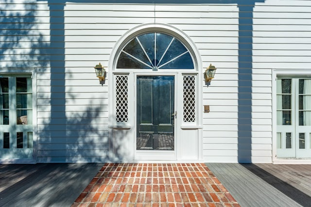 doorway to property with a wooden deck