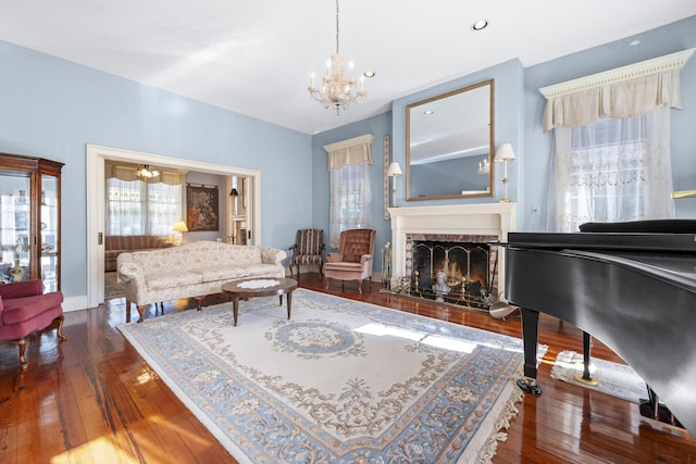 living room with a chandelier and dark hardwood / wood-style floors