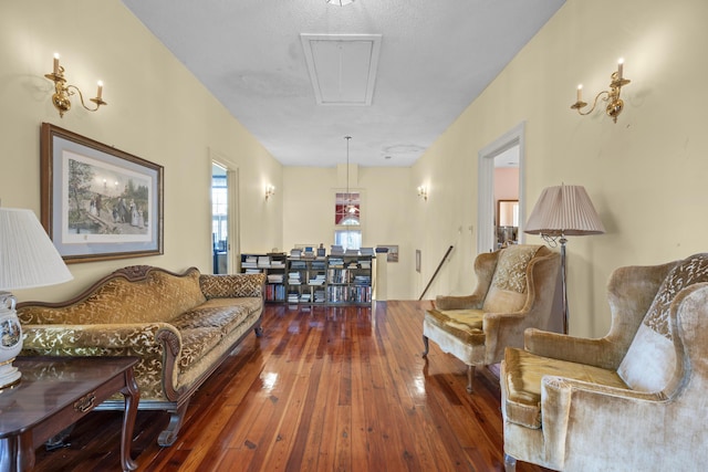 living room featuring a textured ceiling and hardwood / wood-style flooring