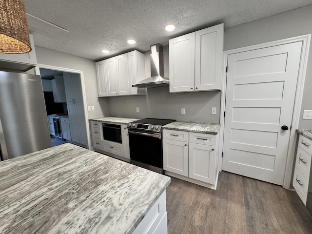 kitchen featuring stainless steel range with electric stovetop, wall chimney range hood, dark hardwood / wood-style flooring, and white cabinets