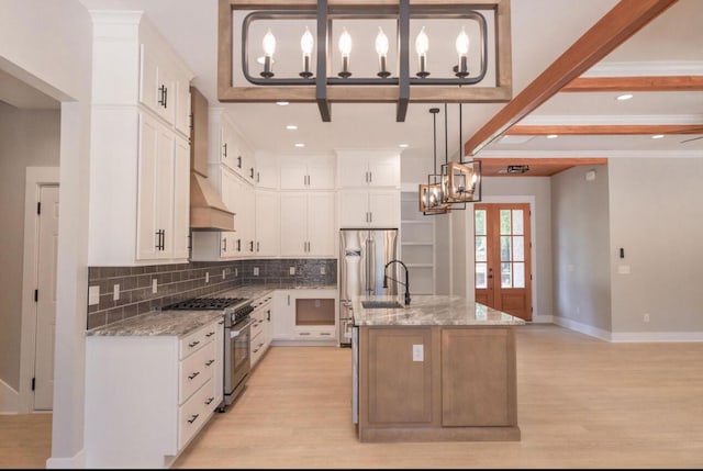 74 Longleaf Dr, Walterboro, SC 29488 - kitchen featuring light wood-type flooring, stainless steel stove, a sink, and backsplash