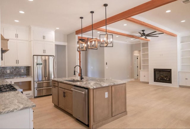 74 Longleaf Dr, Walterboro, SC 29488 - kitchen with ceiling fan with notable chandelier, beamed ceiling, white cabinets, appliances with stainless steel finishes, and a sink