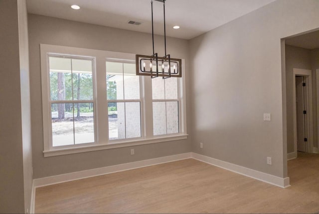 74 Longleaf Dr, Walterboro, SC 29488 - unfurnished dining area with recessed lighting, light wood finished floors, baseboards, and an inviting chandelier