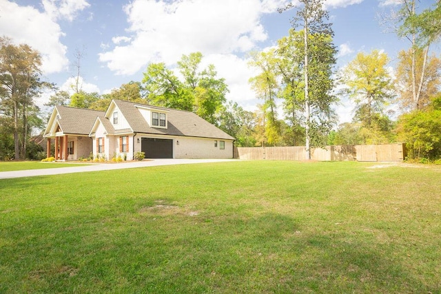 74 Longleaf Dr, Walterboro, SC 29488 - view of home's exterior with concrete driveway, a garage, fence, and a lawn