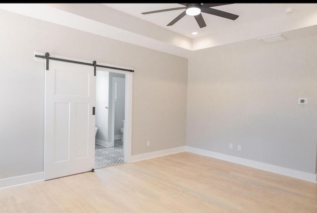 74 Longleaf Dr, Walterboro, SC 29488 - unfurnished room featuring a ceiling fan, recessed lighting, a barn door, light wood finished floors, and baseboards