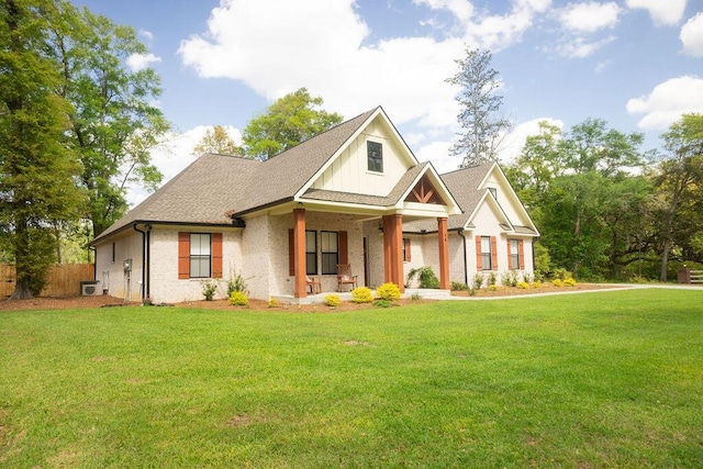 74 Longleaf Dr, Walterboro, SC 29488 - craftsman-style home featuring a front yard, fence, a shingled roof, and covered porch