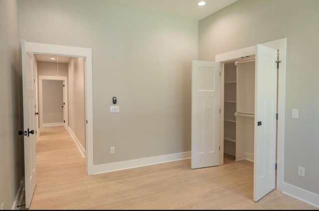74 Longleaf Dr, Walterboro, SC 29488 - unfurnished bedroom featuring light wood-type flooring, baseboards, and a spacious closet