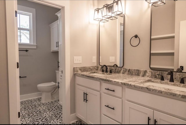 74 Longleaf Dr, Walterboro, SC 29488 - full bathroom with double vanity, baseboards, a sink, and toilet