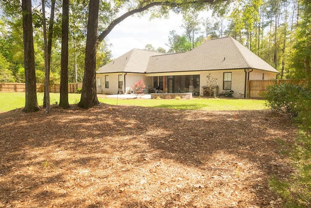 74 Longleaf Dr, Walterboro, SC 29488 - rear view of house featuring a yard and fence