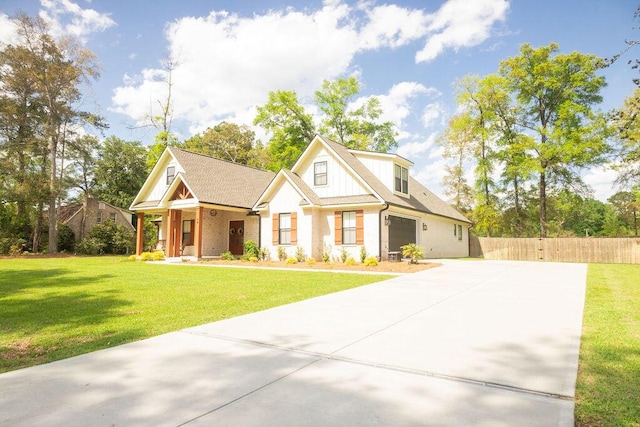 74 Longleaf Dr, Walterboro, SC 29488 - view of front of house with concrete driveway, a front yard, and fence