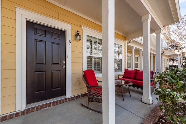 entrance to property featuring covered porch