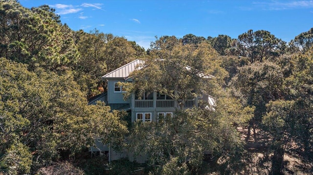 back of house with a balcony