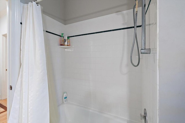 bathroom featuring shower / bathtub combination with curtain