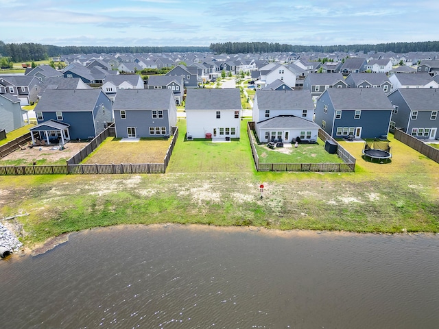 aerial perspective of suburban area featuring a nearby body of water