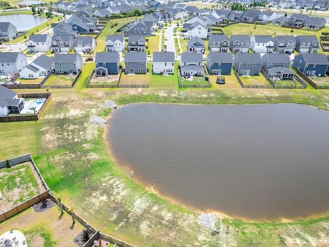 aerial view of residential area with a large body of water