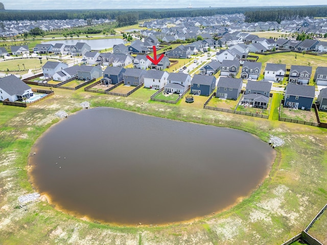 aerial perspective of suburban area featuring a large body of water