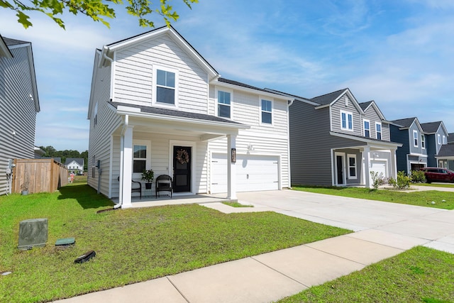traditional-style house with concrete driveway, a garage, a residential view, and a porch