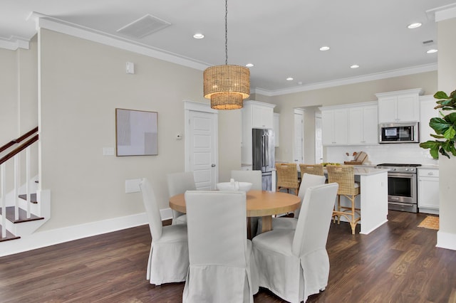 dining space featuring dark wood-type flooring and ornamental molding