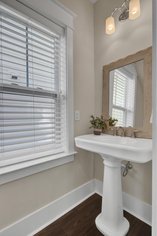 bathroom featuring hardwood / wood-style flooring and sink