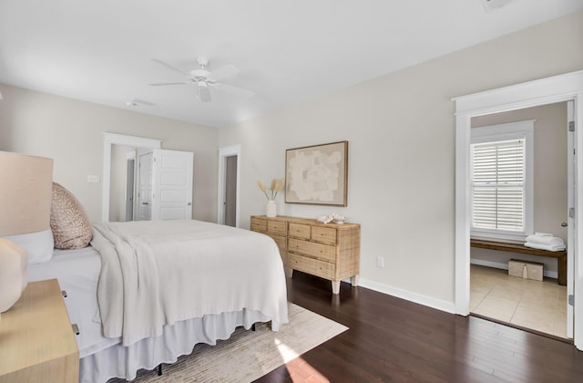 bedroom featuring ceiling fan and dark hardwood / wood-style flooring