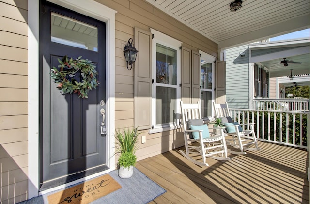 wooden deck featuring ceiling fan and a porch