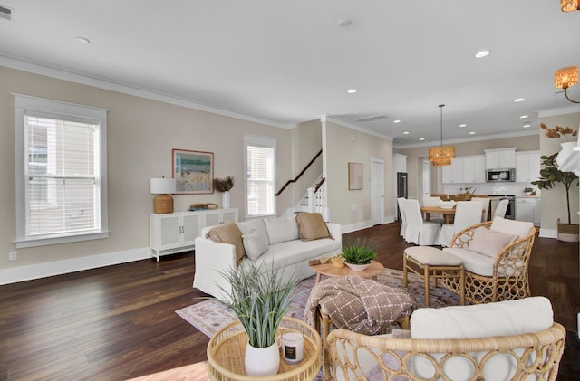 living room featuring dark wood-type flooring, a wealth of natural light, and crown molding