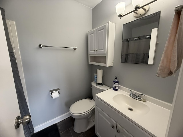 bathroom featuring a shower with curtain, baseboards, toilet, tile patterned floors, and vanity